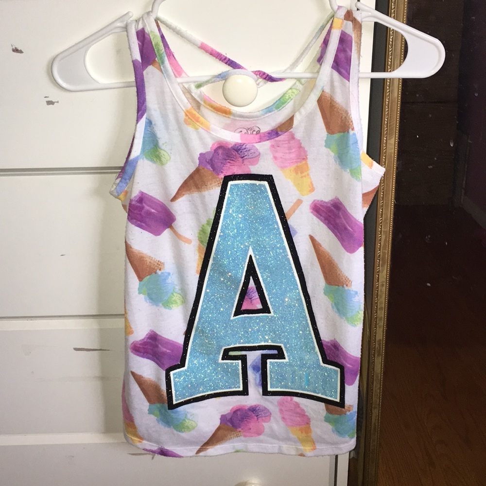 Justice Top with sparkles/glitter on it